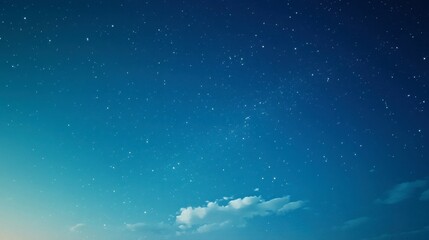 Fototapeta premium A tranquil blue sky transitioning to dusk, with scattered stars and the subtle presence of the galaxy's core.