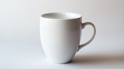 Obraz premium a plain white ceramic coffee mug set against a light gray background. The mug has a simple, classic design with a comfortable handle, showcasing its potential for customization or branding.