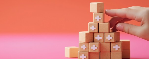 A hand is adding a block to a colorful structure made of interlocking cubes, emphasizing creativity and construction.