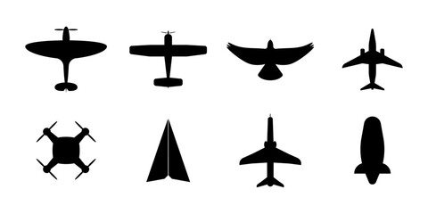 Aircraft top view icon set. Set of black silhouette airplanes, paper plane, drone,  dirigible, etc.