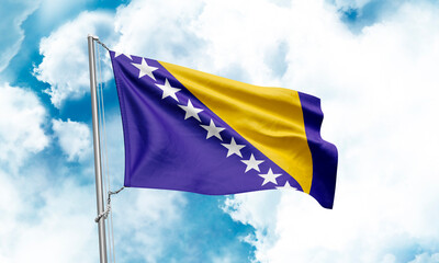Bosnia and Herzegovina flag waving on sky background. 3D Rendering
