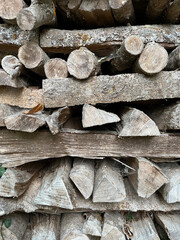 Round an triangular logs, stacked in an unusual manner