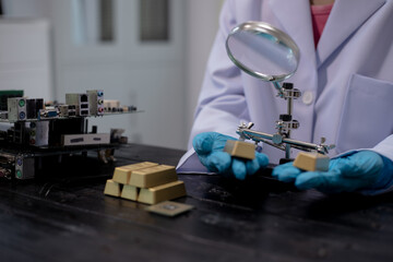 Technicians meticulously repair electronic components to turn them into precious gold. This process...