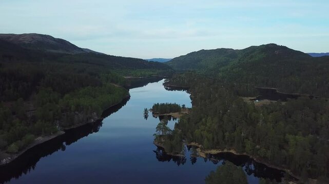 Aerial footage of the scenic Glen Affric nature preserve during daytime in Cannich, Scotland, UK