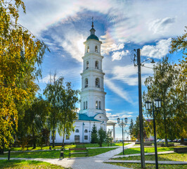 Fototapeta premium Bell tower of the Spassky Cathedral in autumn. Yelabuga, Tatarstan. Sunny day in the park near the cathedral. Main Orthodox Cathedral of the city