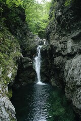 Obraz premium Adventure in Canyoning with Rappelling Over Waterfall
