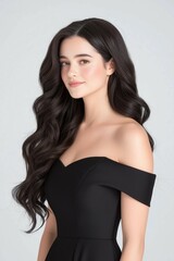 A Beautiful Young Woman with Long Wavy Hair Posing Confidently in a Studio Portrait