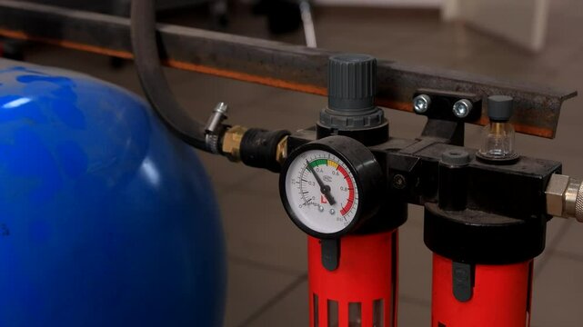 Industrial Compressor in Action with Pressure Gauge Reading - Close-Up of Air Blower and Pressure Indicator