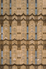 Ornate Gothic Facade with Vertical Windows and Intricate Carvings