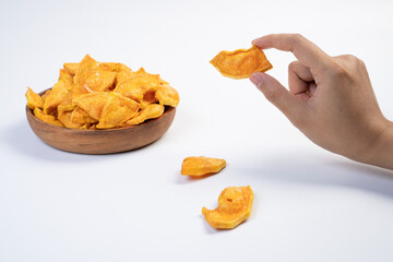A person is holding a piece of food in their hand