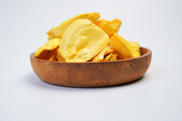 A bowl of yellow fruit chips