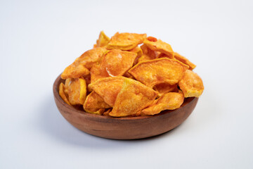 A bowl of fried food with a lot of pieces in it