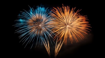 A vibrant display of blue and orange fireworks lighting up the night sky in celebration, creating a festive atmosphere.