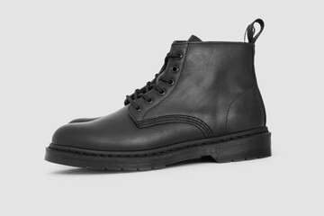 Black leather boots on white background. Fashion 