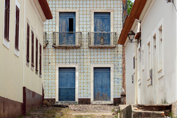 Facade of a historic building with Portuguese tiles in ruins in Alcantara-Maranhão