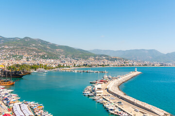 Panorama of Alanya on a summer day, view of the mountains, bay and ships