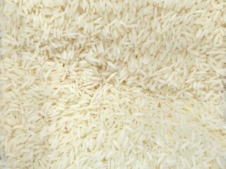 Raw rice grain background. Thai Jasmine rice texture. Raw food