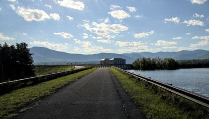 dividing weir building on bridge across ashokan reservoir hudson valley new york upstate (drinking water management concrete structure on road) nyc pipe pipeline plumbing catskill mountains catskills