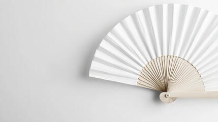 Close-up view of a white folding hand fan, fully opened against a bright white background for product mockup.