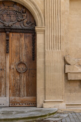 Ornamented wooden door in Aix-en-Provence in Provence-Alpes-Cote d'Azur region in the South of France