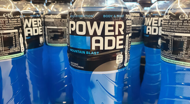 Viersen, Germany - October 9. 2024: Closeup of bottles blue Powerade sports drink in german store shelf