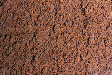 Roasted coffee powder, food background.