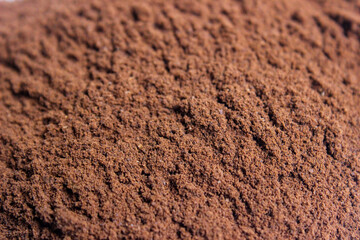 Roasted coffee powder, food background.