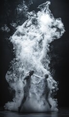 Two figures dance in a smoke cloud.