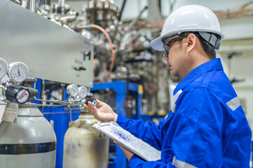 Asian engineer working at Operating hall,Thailand people wear helmet  work,He worked with diligence...