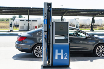 A hydrogen fueling station. Refueling car with hydrogen fuel