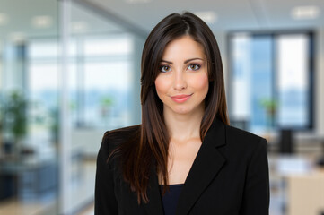 Businesswoman smiling in modern office building