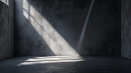 Fototapeta premium An empty studio features a spotlight on a textured backdrop, enhancing light, shadows, and industrial elegance.