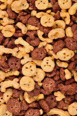  Chocolate flakes in the form of skulls and bones background. Top view.