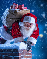 Santa Claus is climbing down a chimney on a snowy night, carrying a bag full of presents  © Inspire Shots Hub