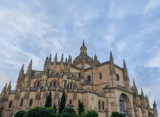 Segovia Cathedral with a blue sky and few clouds at sunset in Spain