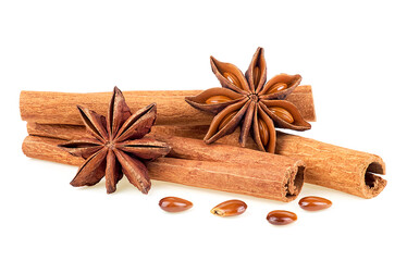 Cinnamon sticks and anise stars isolated on a white background. Spicy spice for Christmas baking, drinks and desserts. Cinnamon roll and star anise.