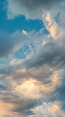 Sunset cloudscape with rays piercing through.