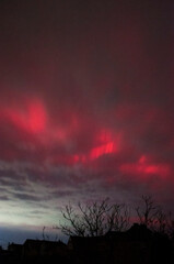 Aurora Borealis over a small town in Ukraine. Red northern lights.