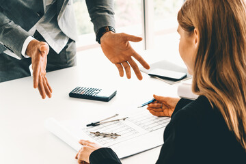 Architect and engineer working with construction drawing project on table in office. Architecture...