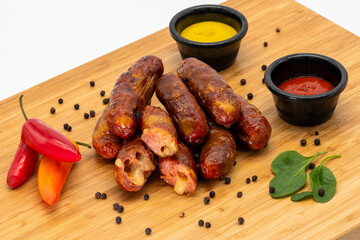 Enjoying Deliciously Grilled Sausages Served with a Variety of Dipping Sauces and Spices