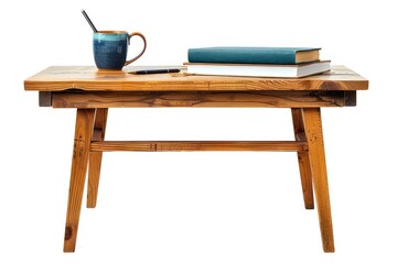 A wooden study table with a pile of textbooks, a pen, and a mug isolated on white