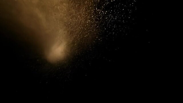 Abstract dynamic cloud of dust particles dispersing against black background in explosion