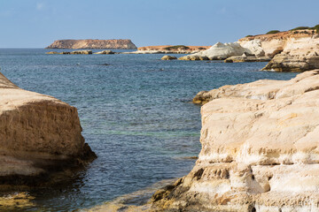 Secluded beach and limestone rock formations, Sea Caves, Peyia, Paphos, Cyprus