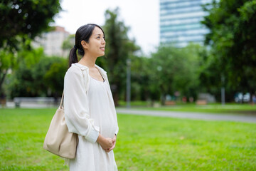 Pregnant woman in the park