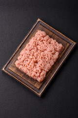 Fresh raw chicken mince with salt, spices and herbs