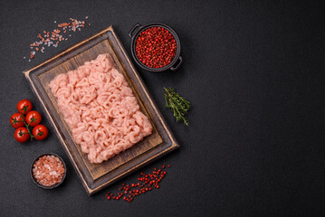 Fresh raw chicken mince with salt, spices and herbs