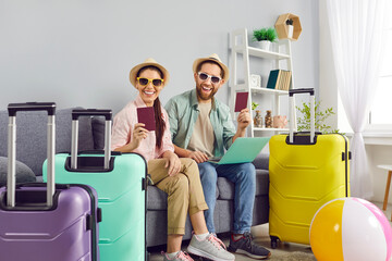 Couple vacation happy online tour registration, packing suitcase together, planning, preparing for travel or recreation. Pair dreaming of enjoyment, sea relaxation, going leisure trip, summer journey