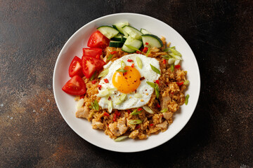 Nasi goreng, fried rice with chicken and egg in Indonesia style. Asian food