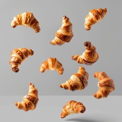 Croissants that fresh and delicious falling in the air isolated on background