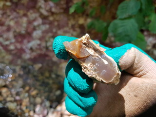 Inspection of the found fragment of chalcedony, search for stones and minerals
